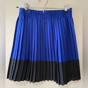 Pleated cobalt and black mini skirt